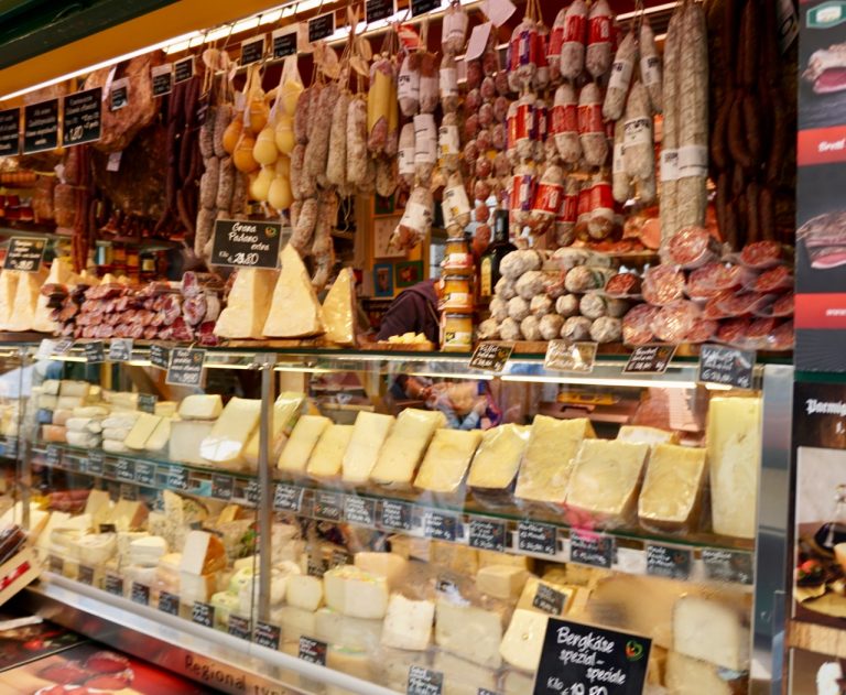 One of many street vendors of cheeses, sausages, and more
